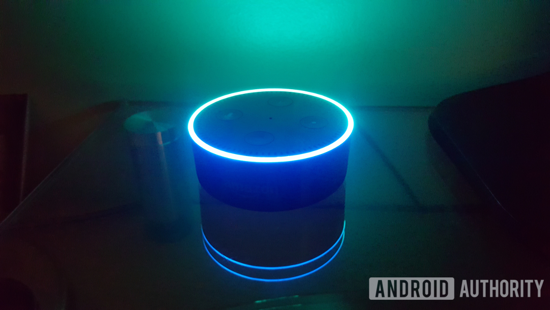Blue LED smart speaker on a table - Google Home privacy
