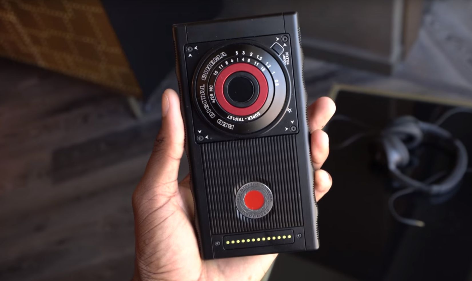red hydrogen one held in hand back side camera red button