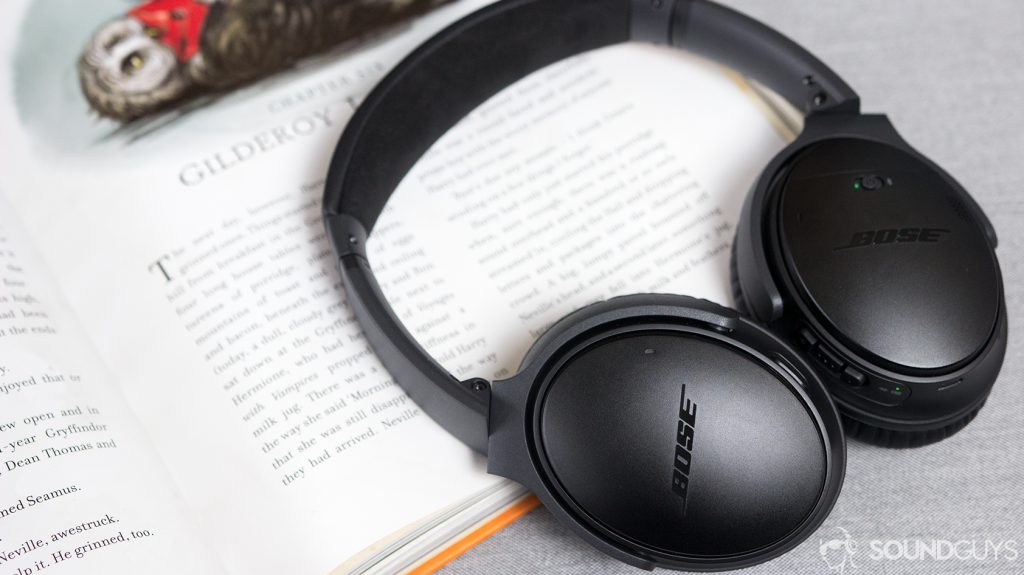 The Bose QuietComfort 35 II noise-cancelling headphones on top of an open book.