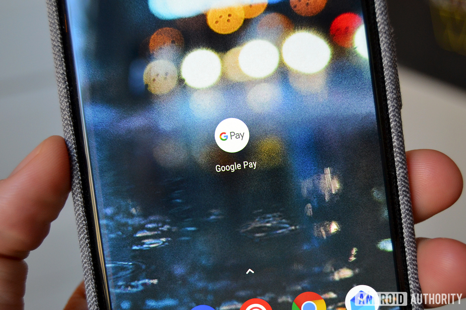 The Google Pay logo on a smartphone.