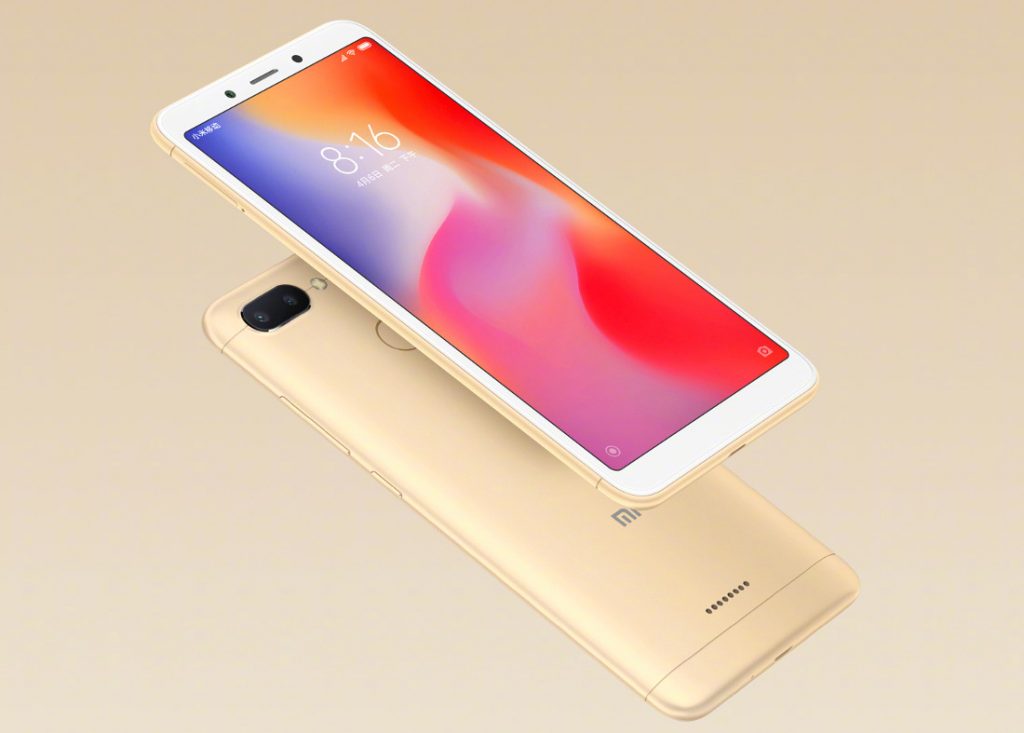 Xiaomi Redmi 6 press render showing the device in gold against a gold background.