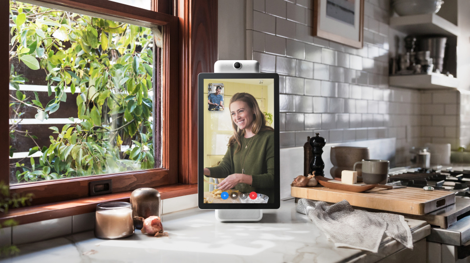 A publicity image of the Facebook Portal smart display in a kitchen.