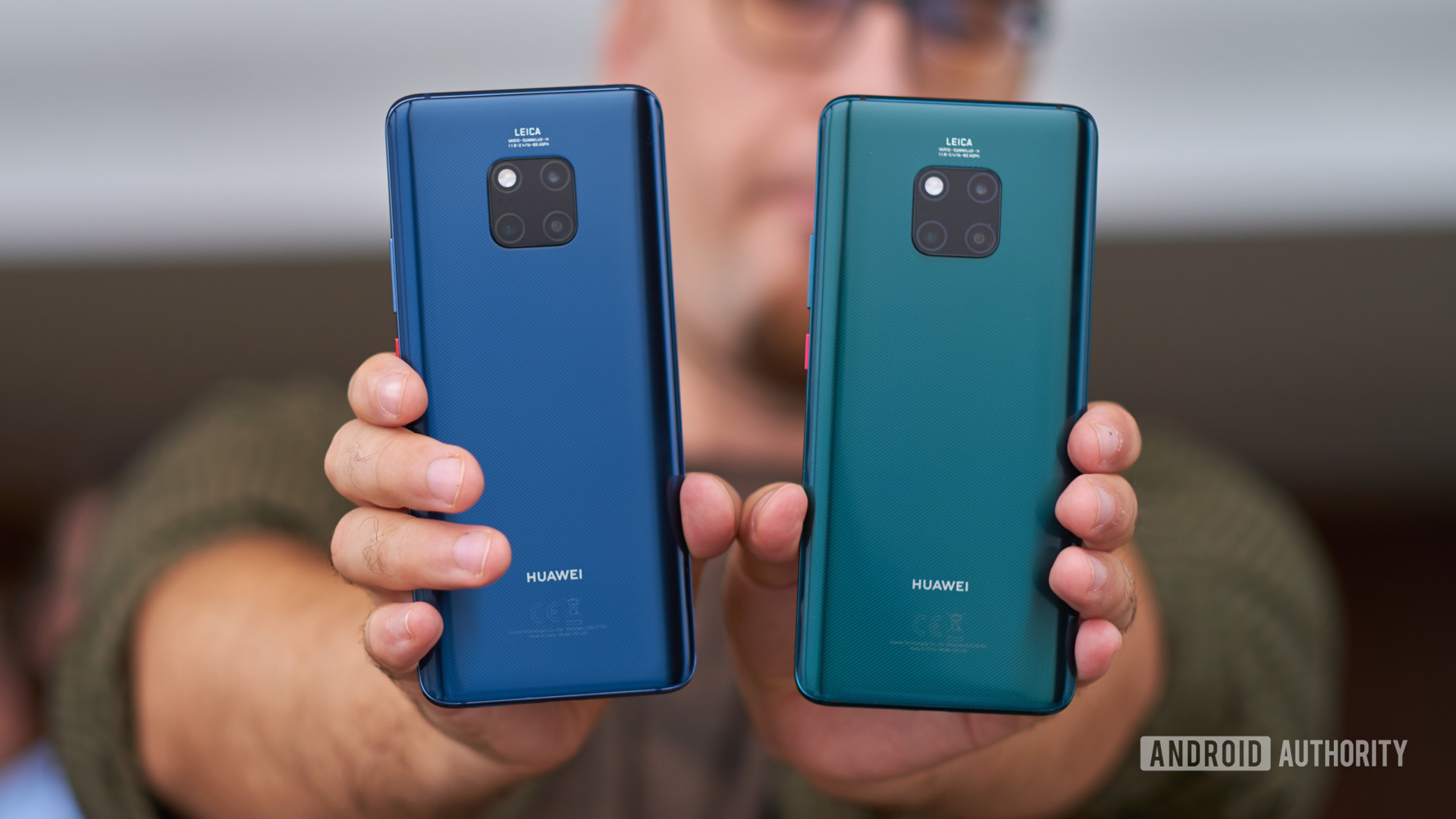 Mate 20 Pro in Midnight Blue and Emerald Green held in hand