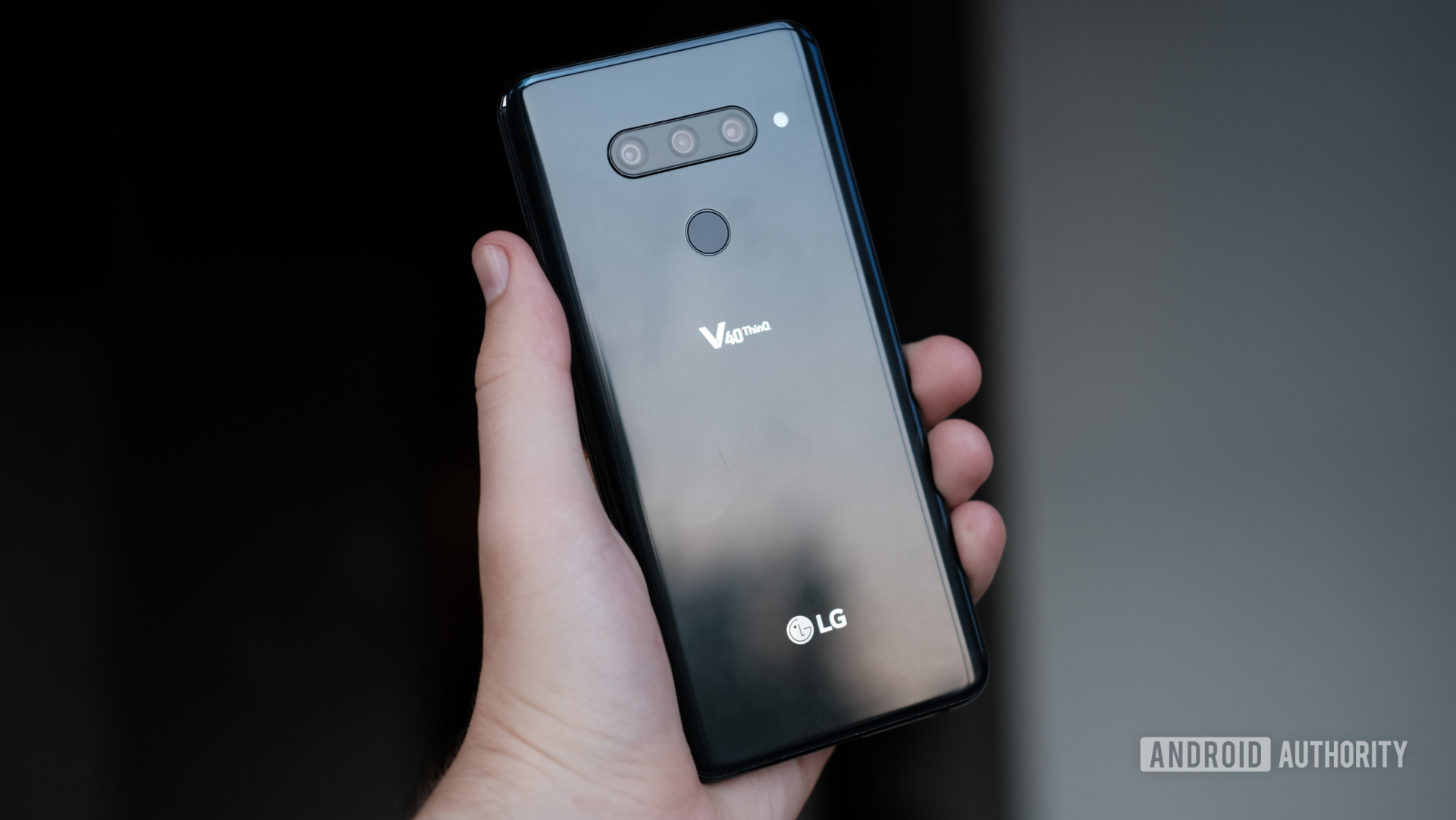 LG V40 ThinQ in hand showing back of phone