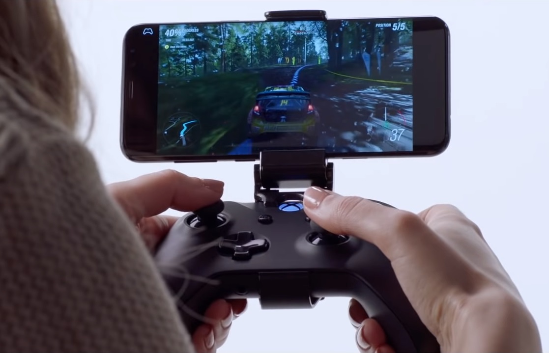 An image of a woman playing a handheld game via Project xCloud, a new game streaming service from Microsoft.
