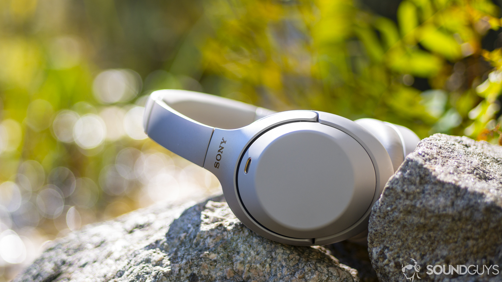 Samsung Galaxy S10 headphone: A photo of the Sony WH-1000XM3 sitting on a stone wall.