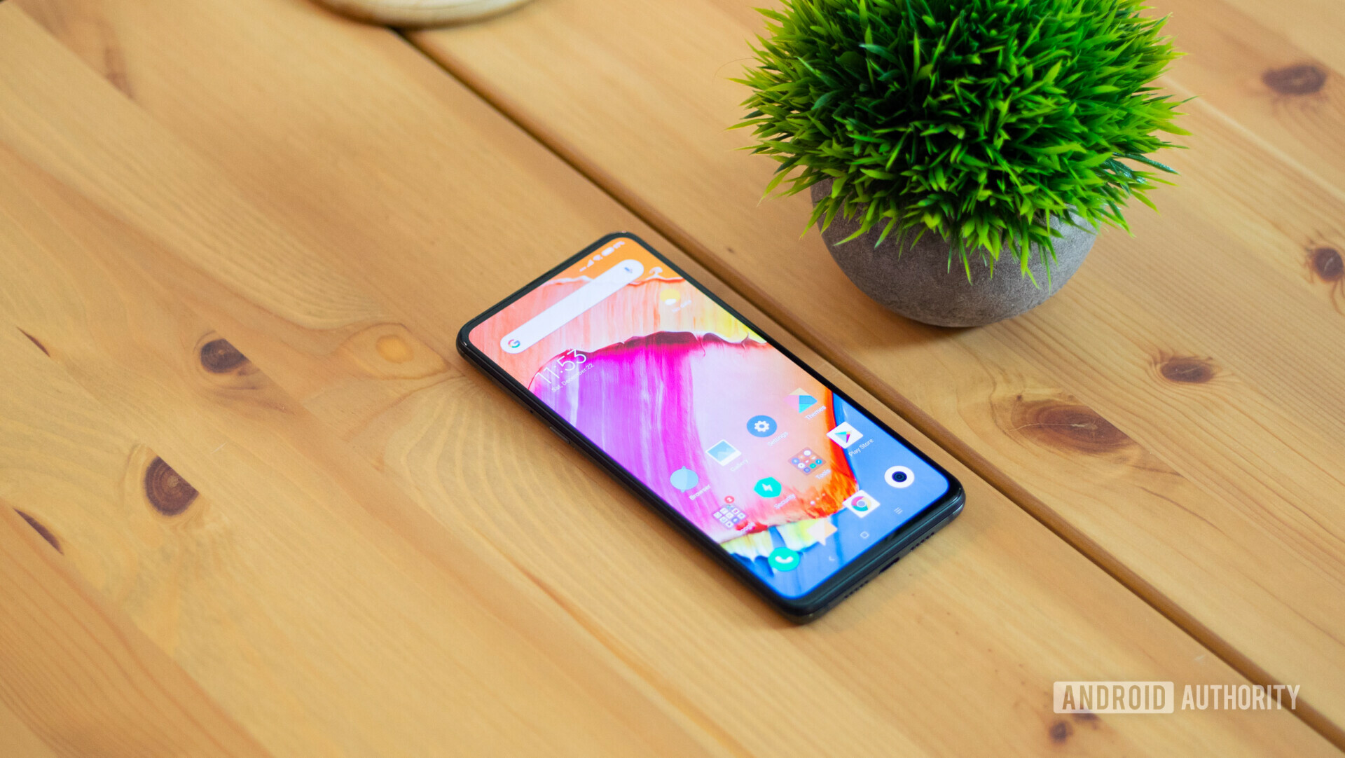 Xiaomi Mi Mix 3 on table with screen turned on. 