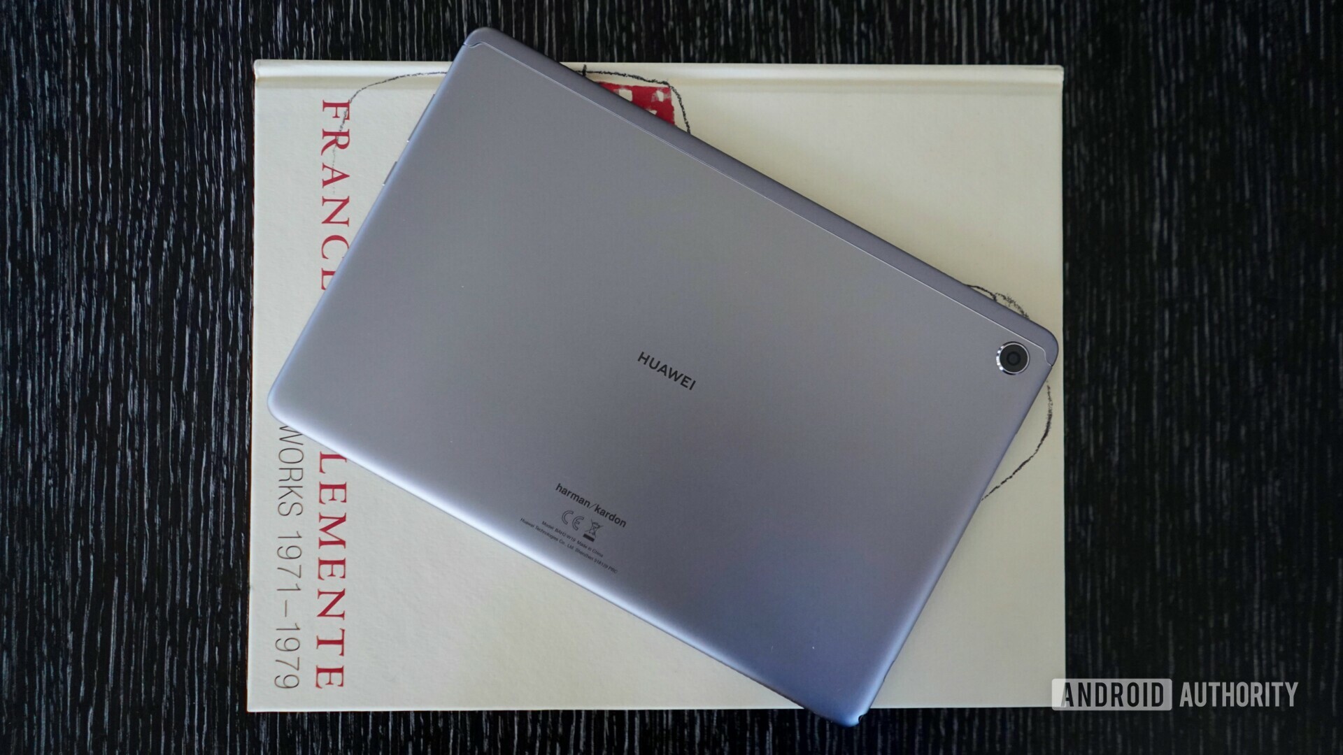 Photo of the backside of the Huawei MediaPad 5 Lite placed on art album