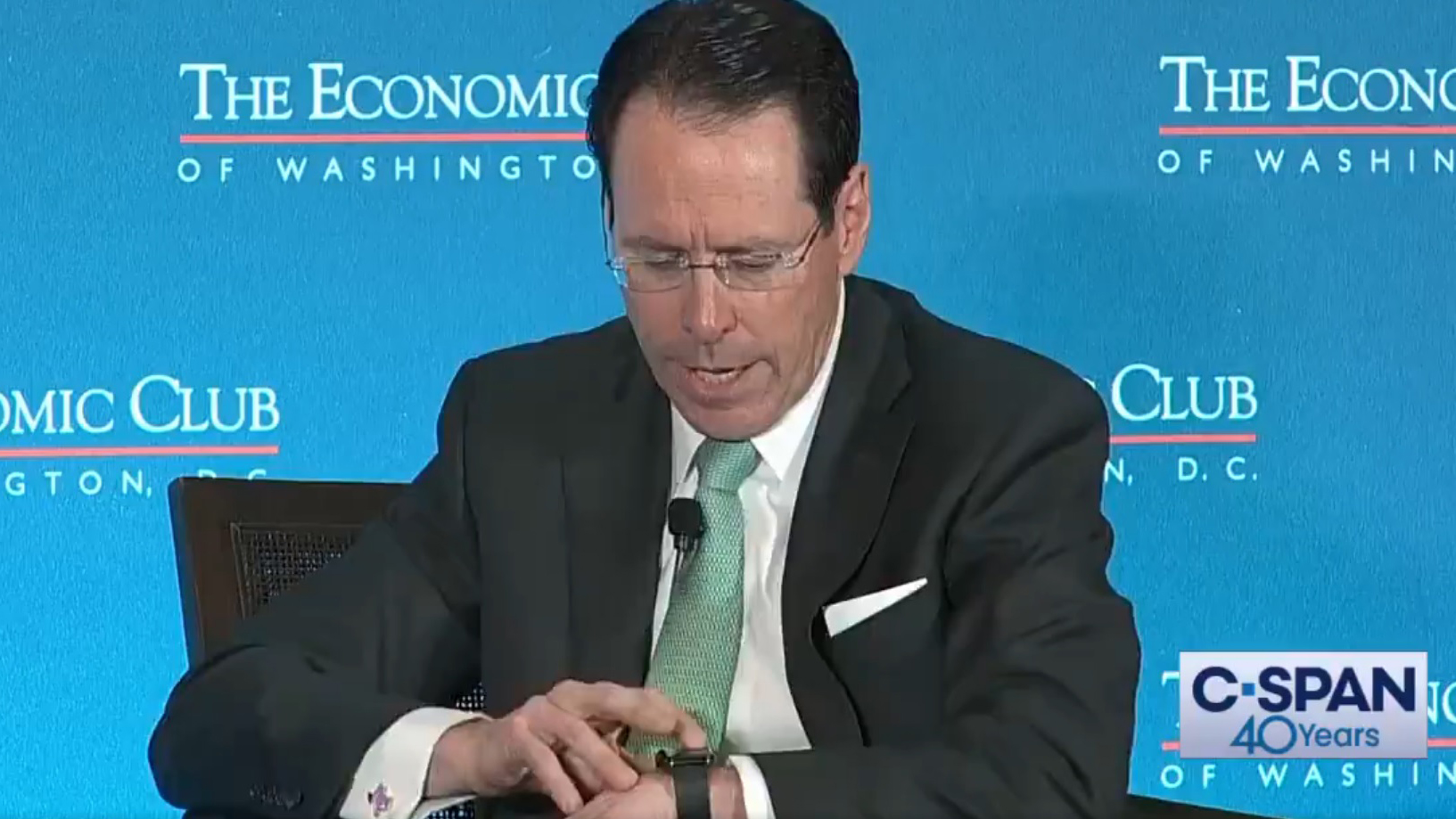 A screenshot of a C-SPAN video where AT&amp;T's CEO gets a robocall live on stage.