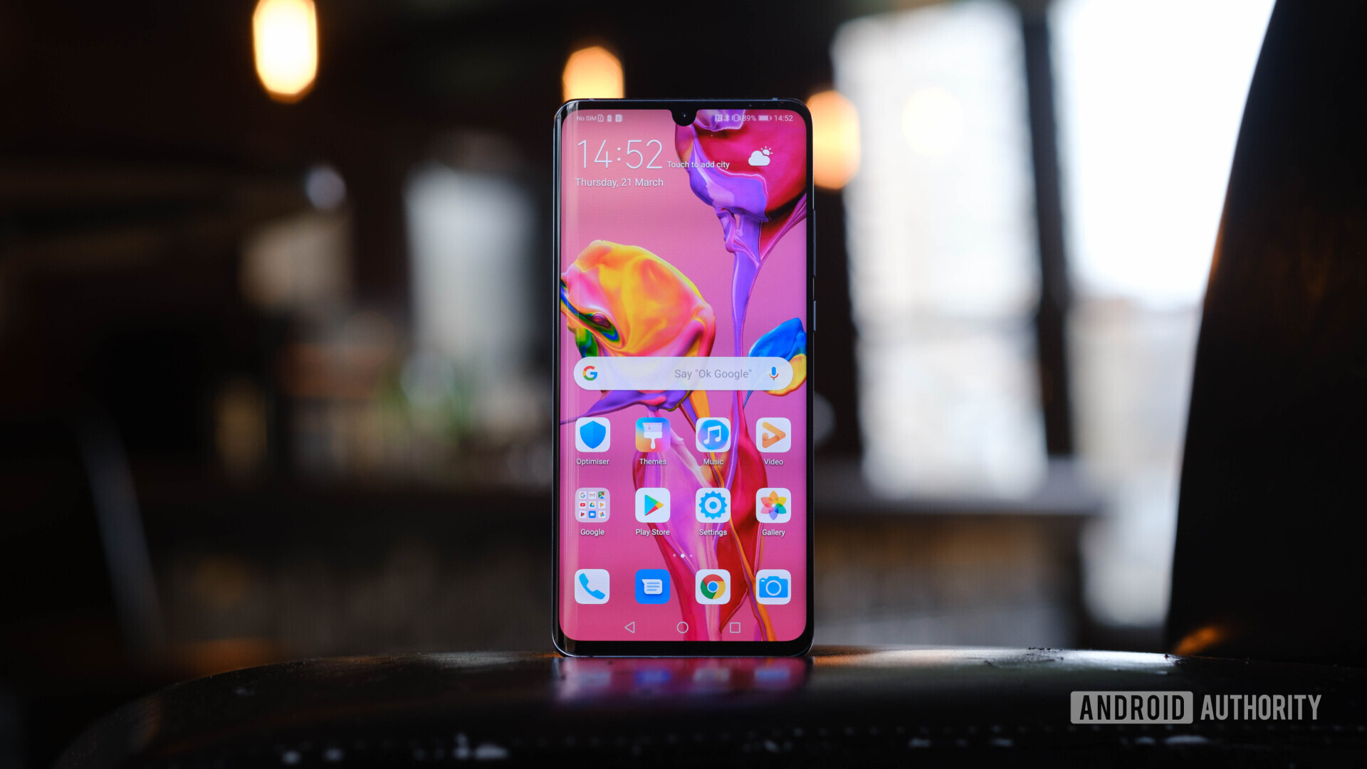 Front side of the Huawei P30 Pro with the screen turned on showing the new EMUI 9.1 launcher.