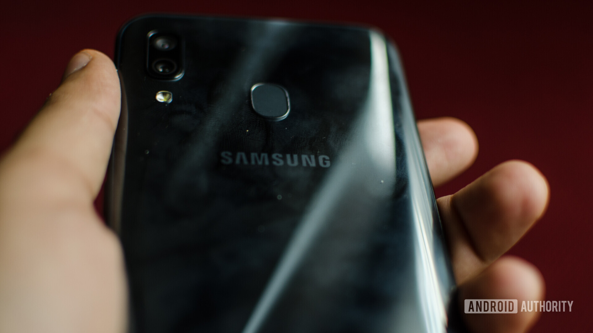 Samsung Galaxy A30 back showing scuffs and fingerprints