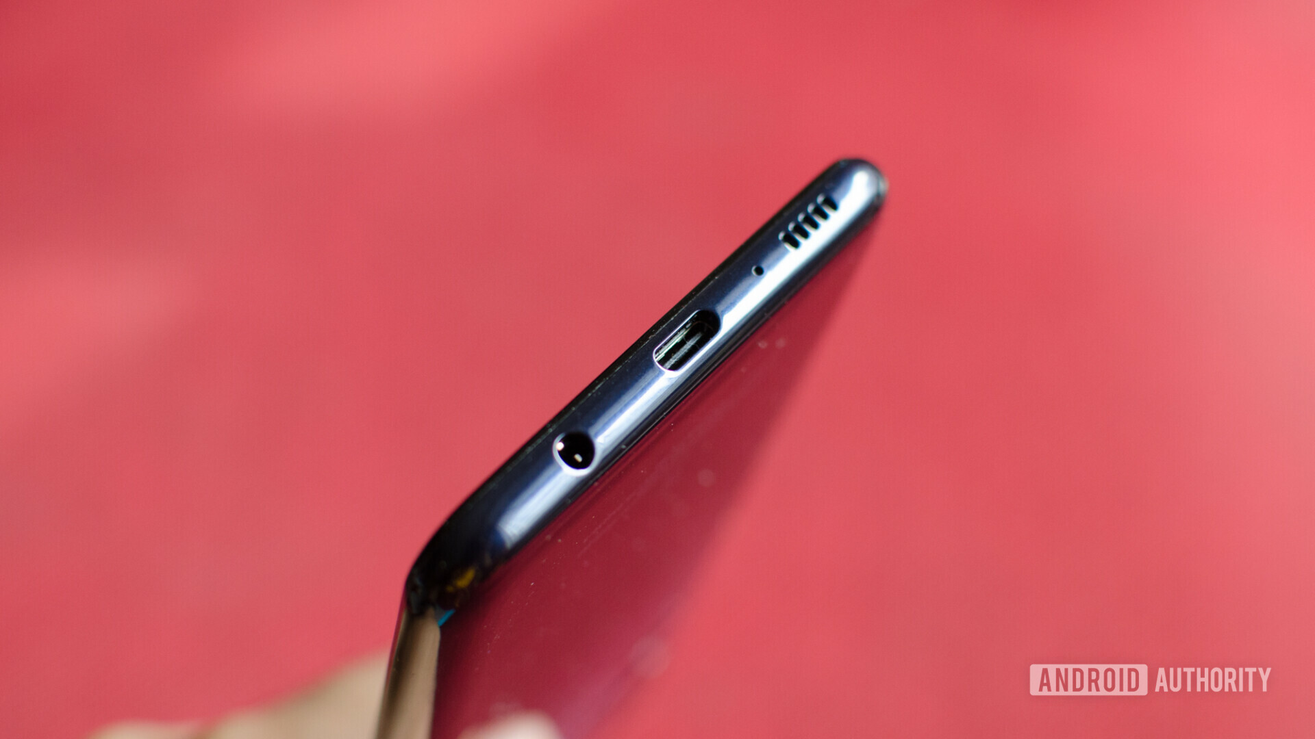 Bottom side of the Samsung Galaxy M30 showing the USB Type-C port and headphone jack.
