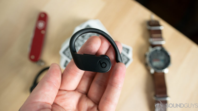  An image of the Beats Powerbeats Pro in a man's hand.