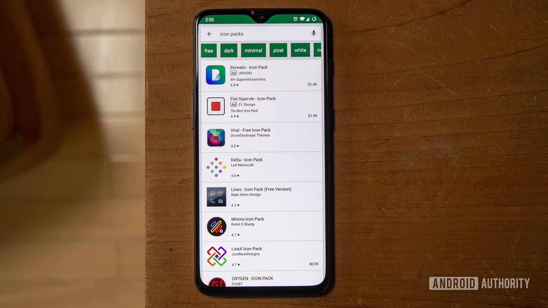 A OnePlus 6T with the search results of &quot;icon packs&quot; in the Google Play Store.