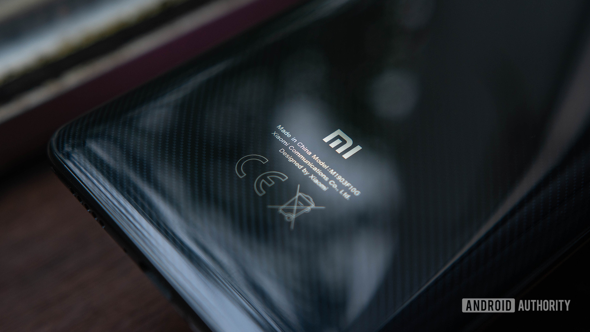 Xiaomi Mi 9T Rear casing focused on logo and carbon texture