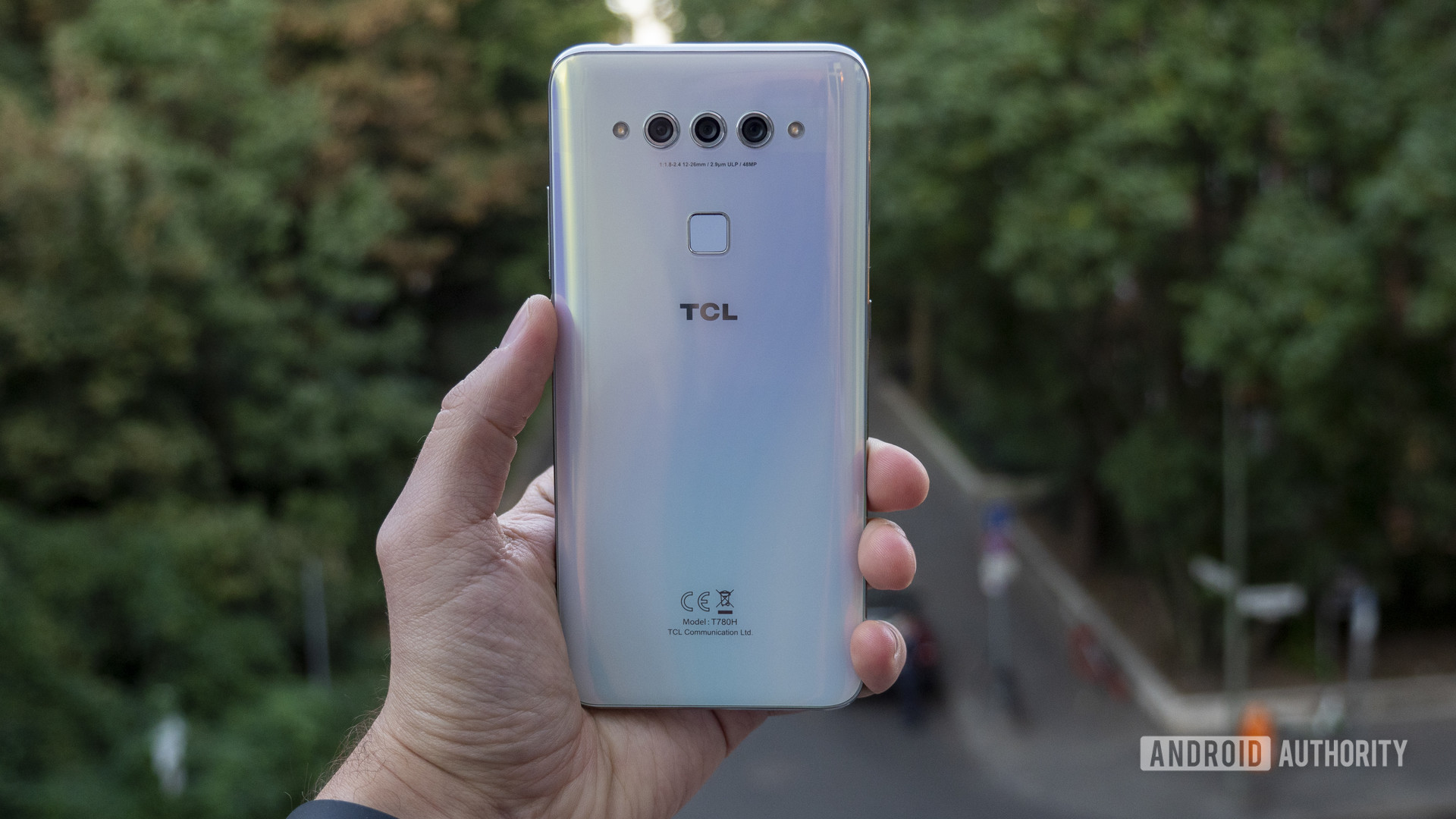 TCL Plex hands on white in hand