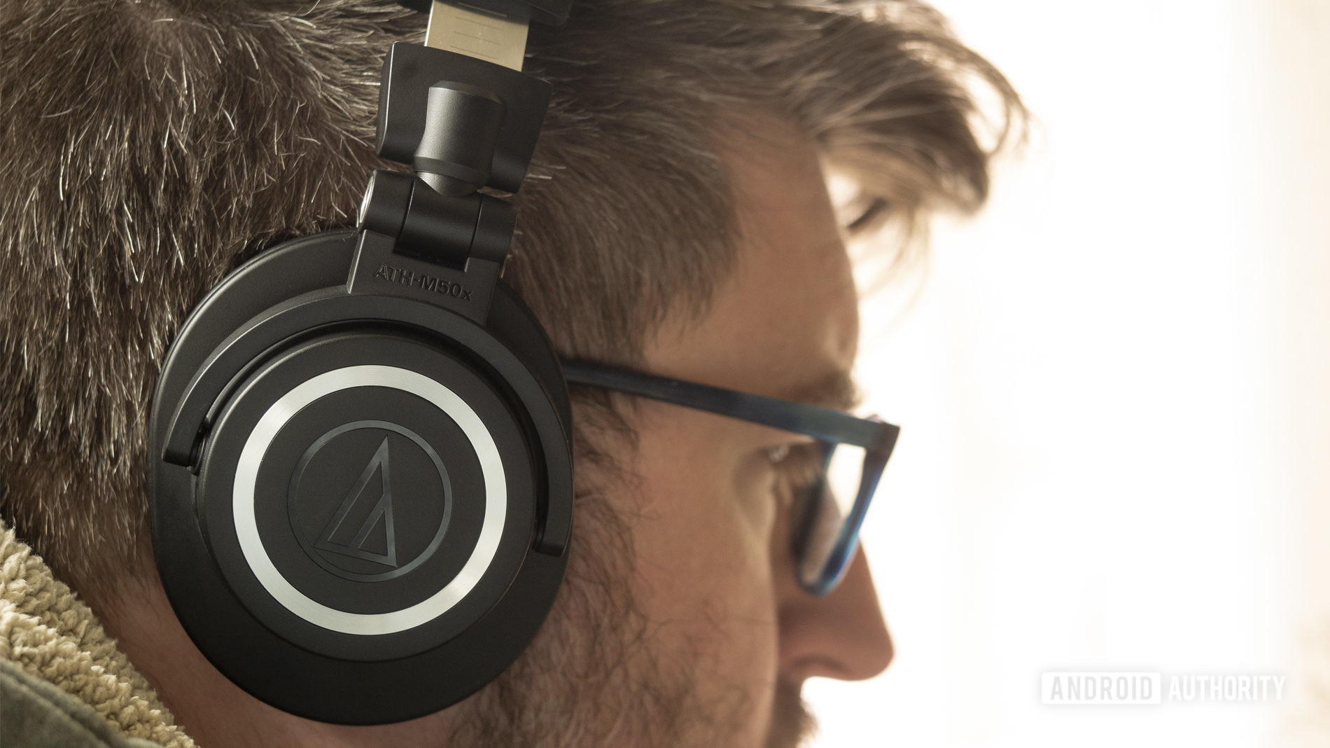A photo of the Audio-Technica ATH-M50xBT on a man's head.