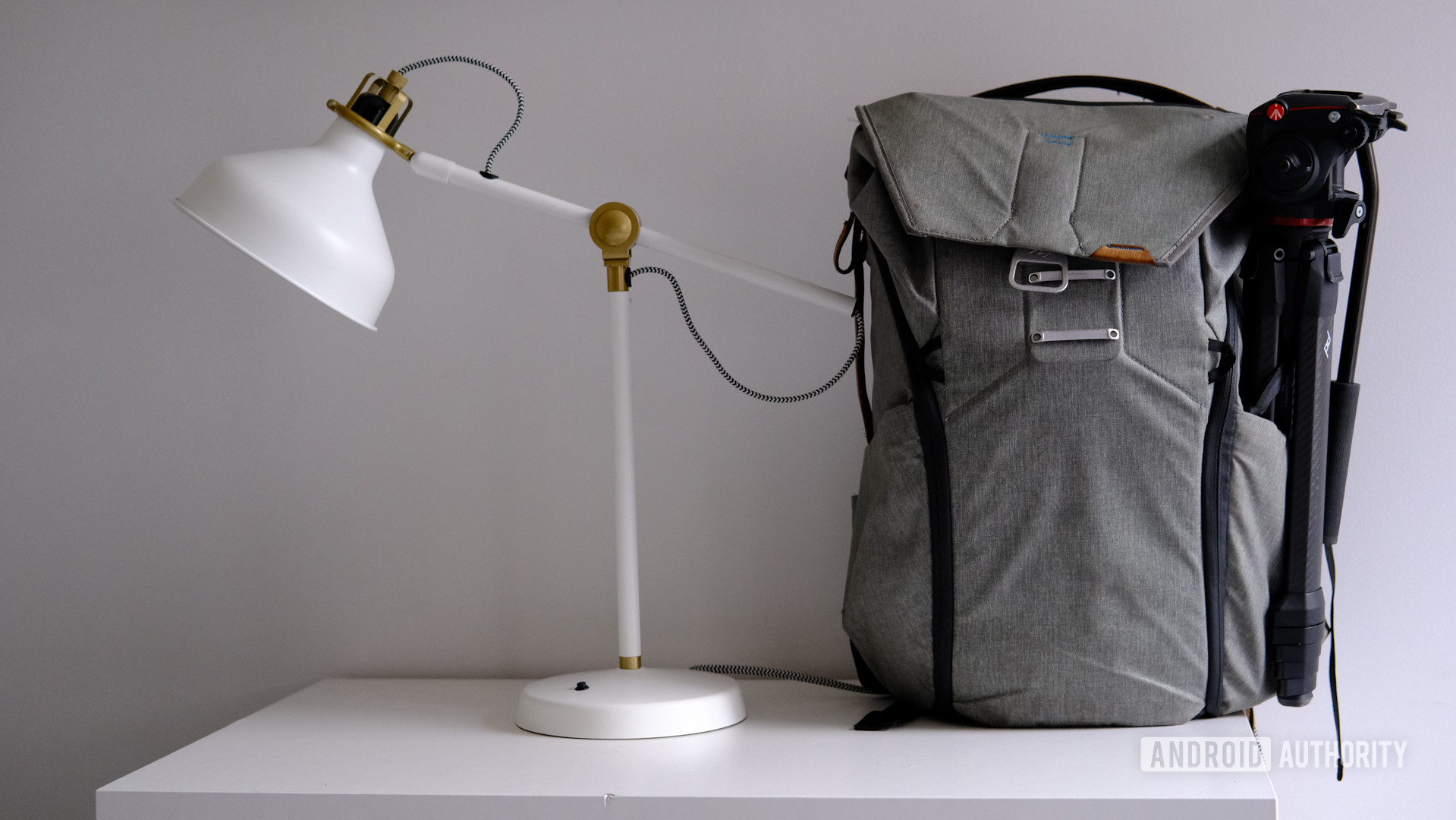 Peak Design Everyday Backpack 30L on table next to a desk lamp.