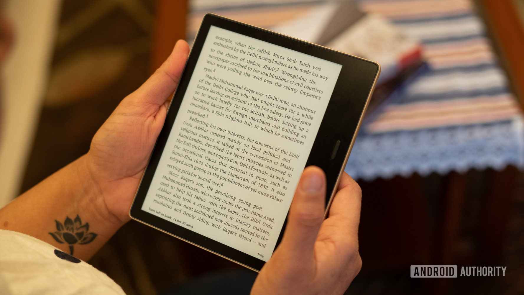 Amazon Kindle Oasis in hand reading
