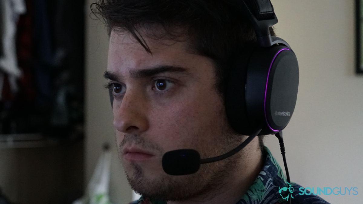 A man wears the SteelSeries Arctis Pro