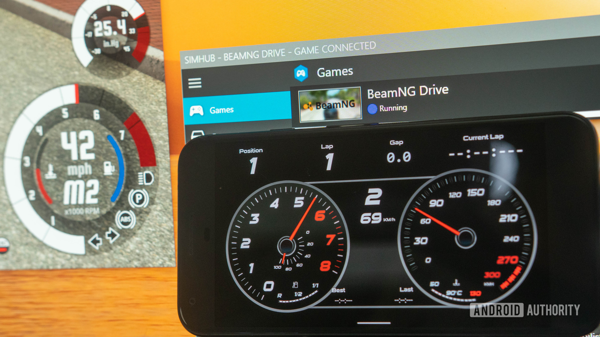 SimHub app next to Windows PC sim racing dashboard
