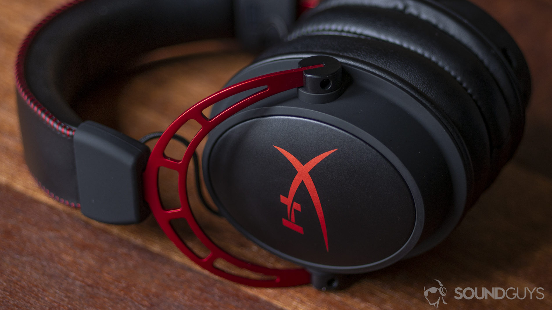 A picture of the HyperX Cloud Alpha gaming headset on a wooden table.