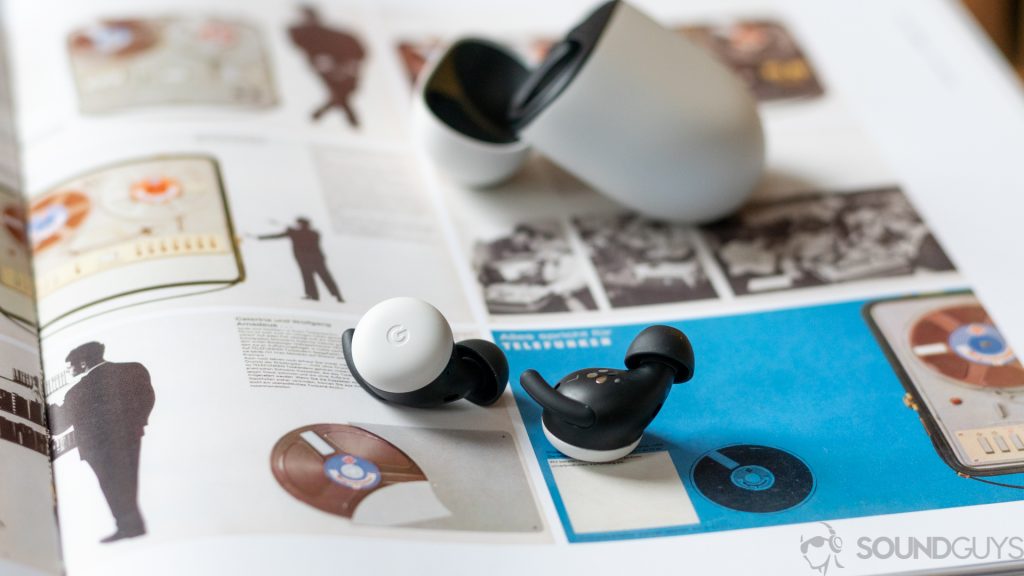 A picture of the Google Pixel Buds 2020 true wireless earbuds against an open book.