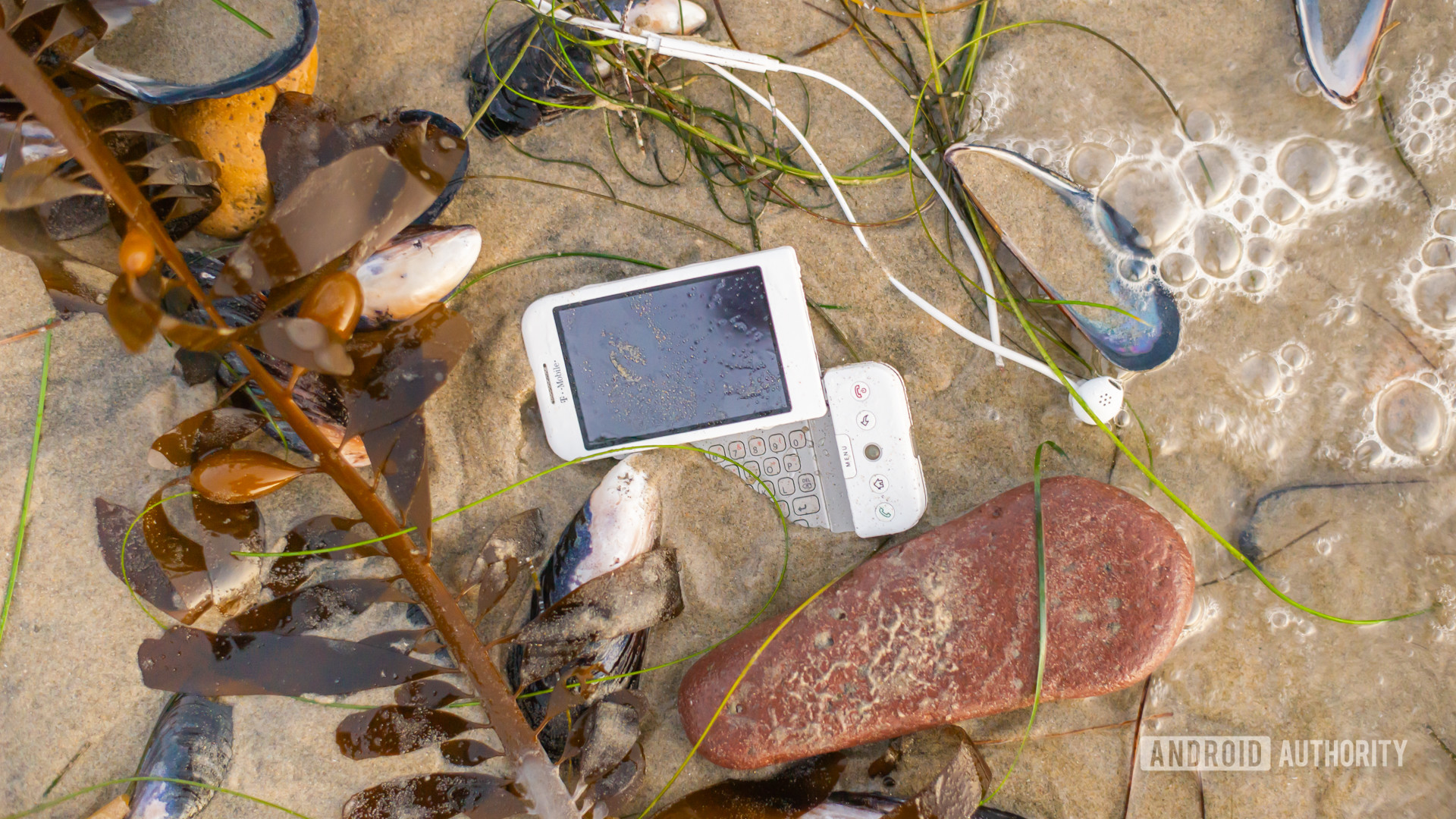 E Waste smartphone on beach1