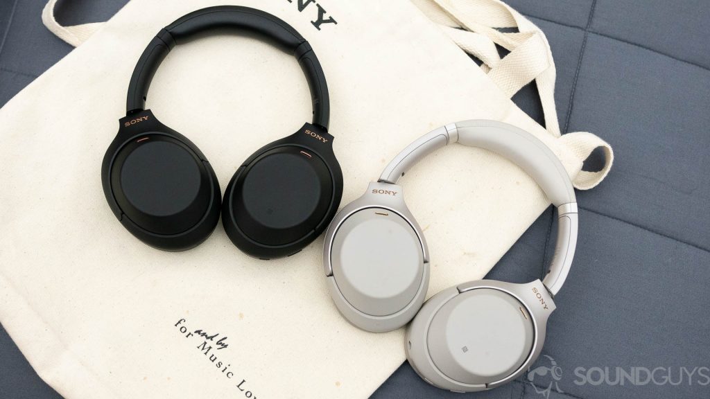 The Sony WH-1000XM4 and Sony WH-1000XM3 headphones sit on a canvas bag next to each other.