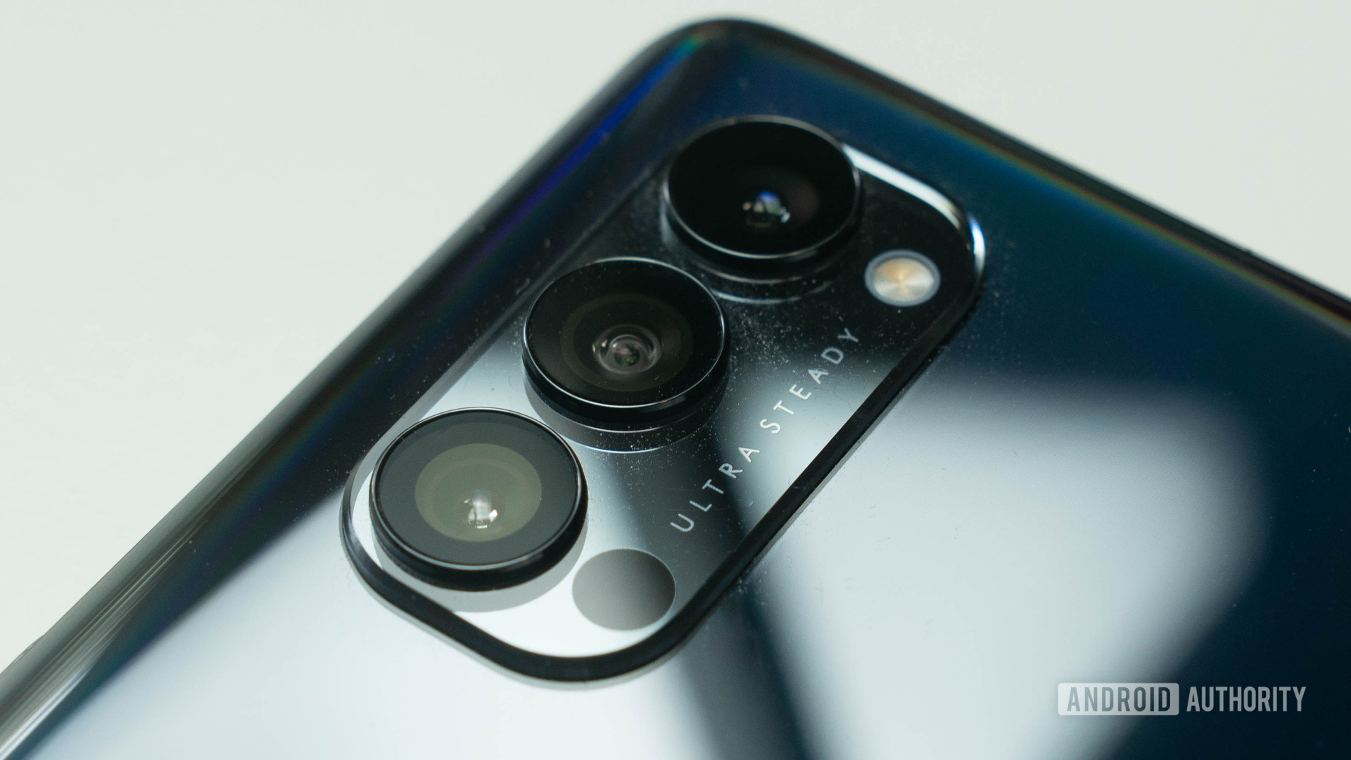 Oppo Reno 4 Pro 5G rear triple camera bump at an angle and on a white table