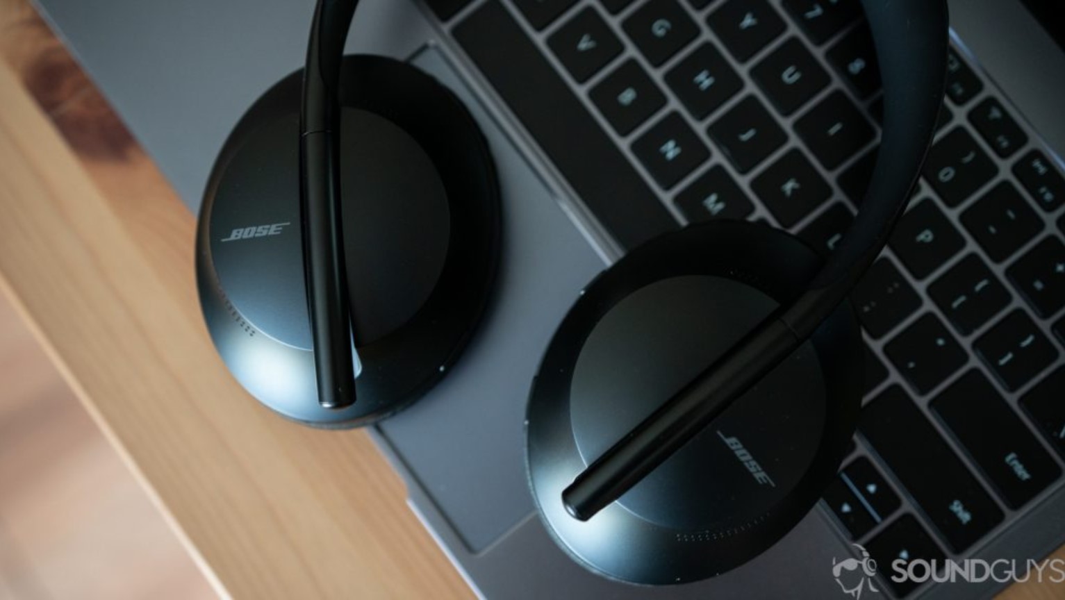 An image of the Bose Noise Cancelling Headphones 700 laying on a keyboard