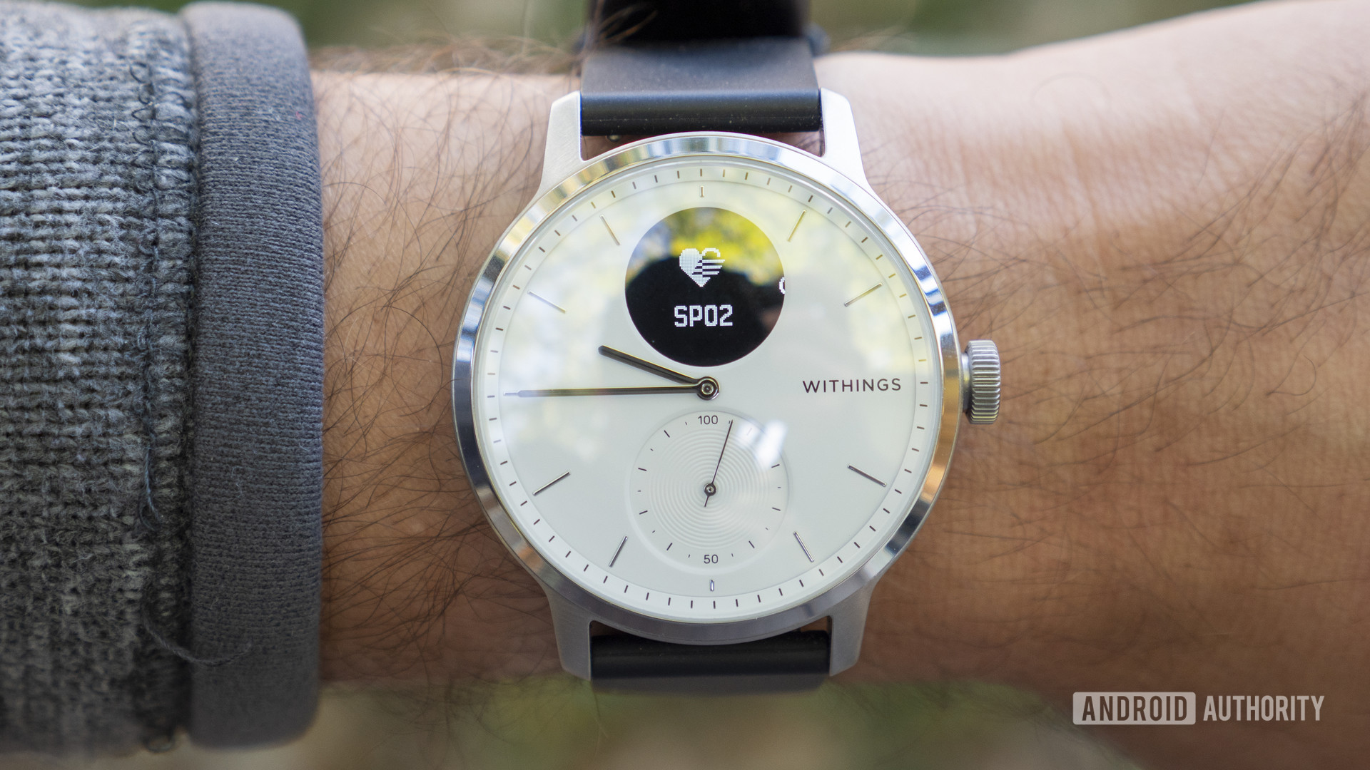 A Withings Scanwatch on a user's wrist displays the the SpO2 feature.