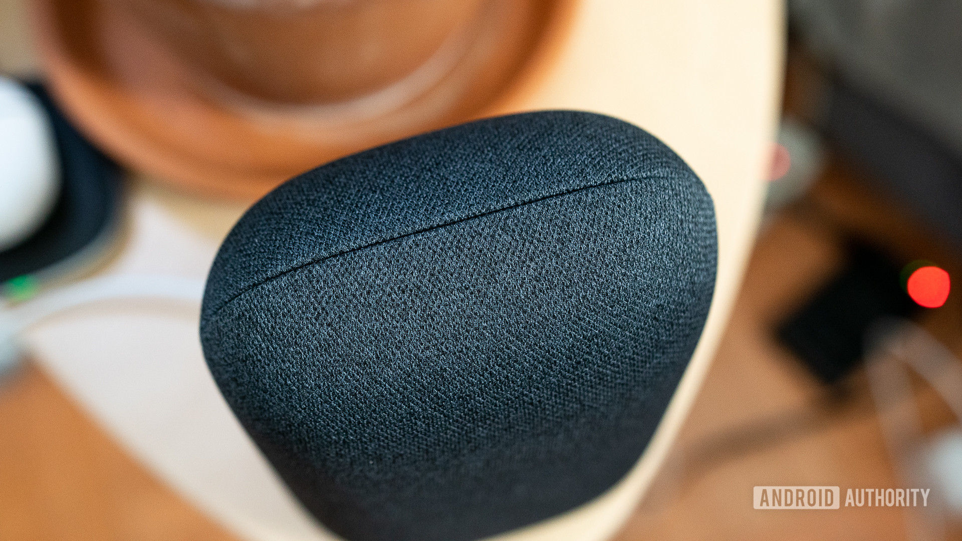 Pictured is the gray Nest Audio fabric stitching on a bedside table