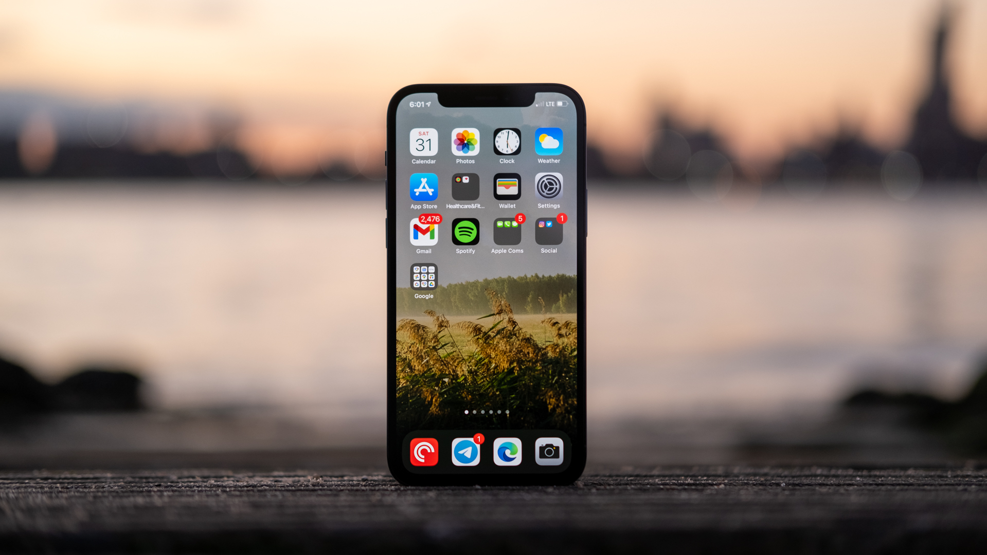 iPhone 12 Pro display stands at sunset