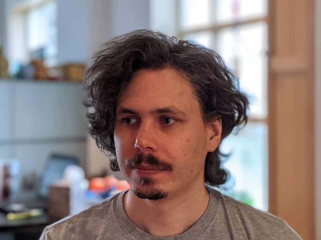 Portrait Indoor Google Pixel 5 of a man with dark hair and facial hair