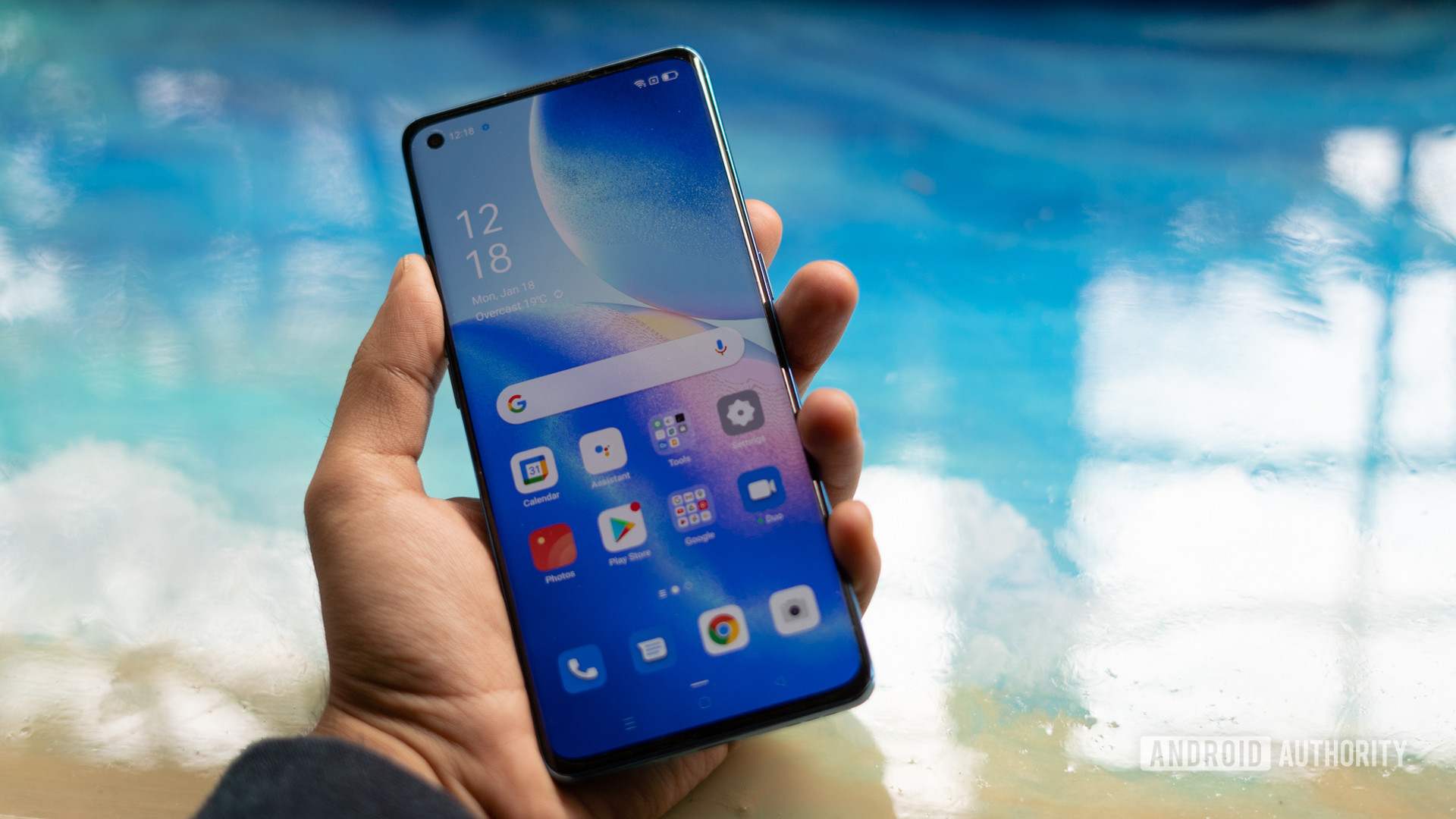 Oppo Reno 5 Pro showing display in hand