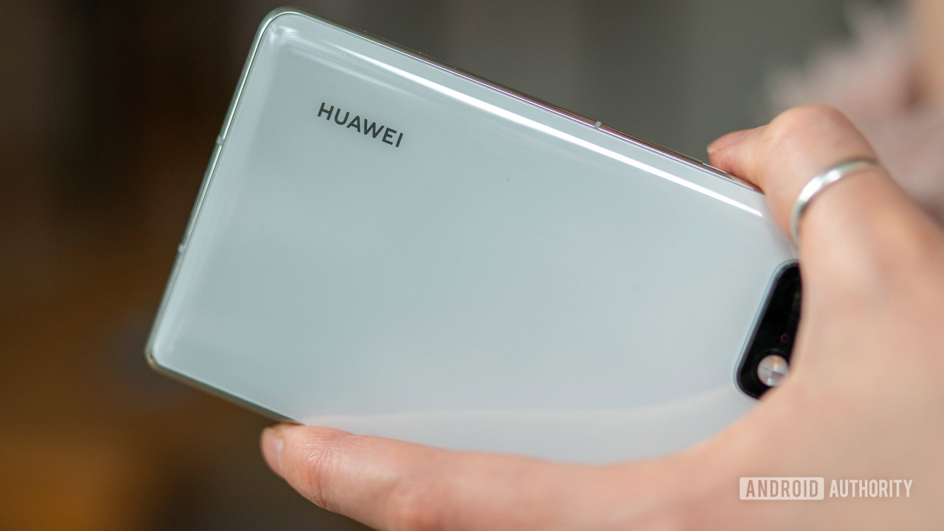 Huawei Mate X2 review phone in hand with Huawei logo
