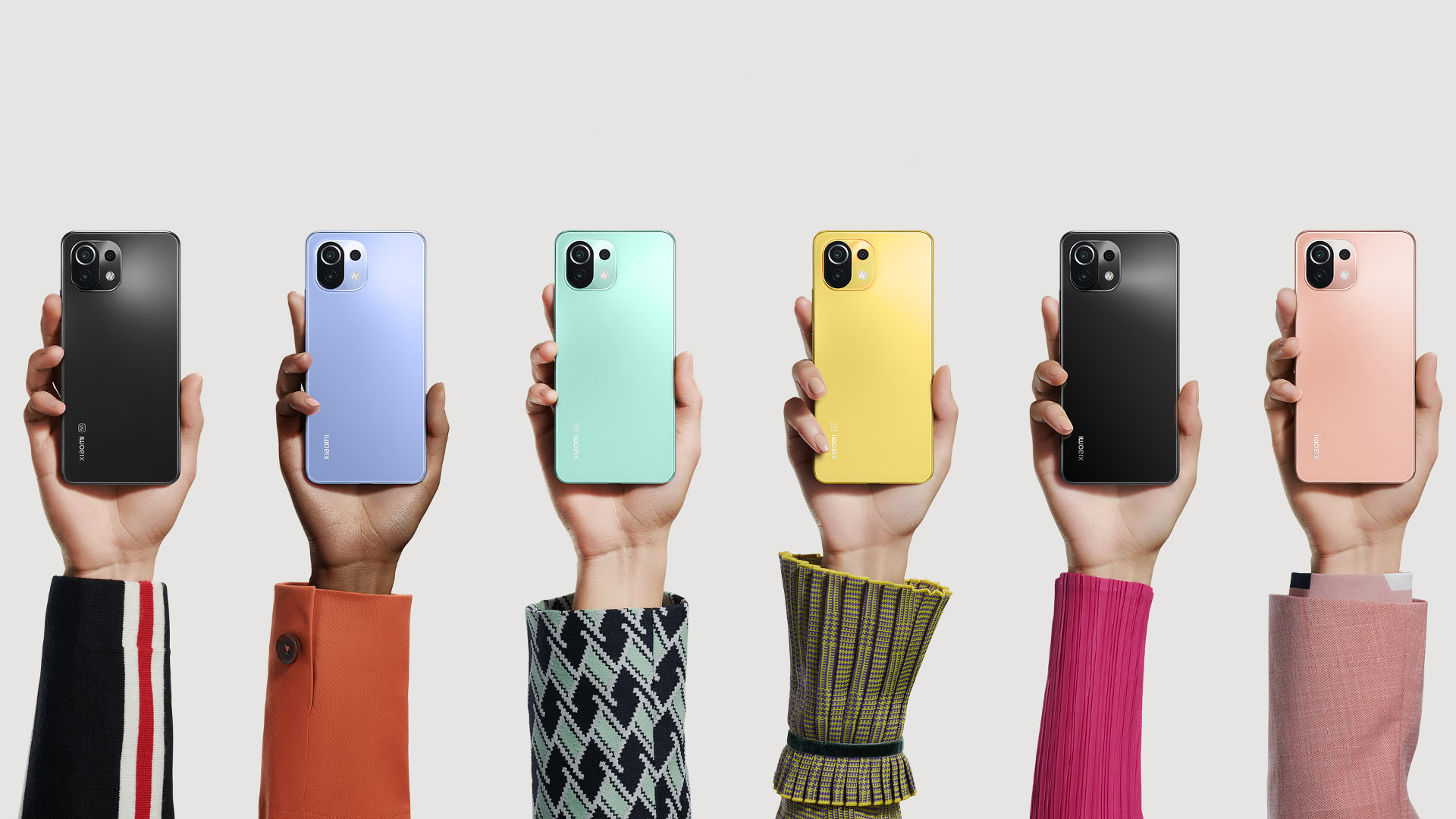 Mi 11 Lite 4G and 5G shot showing the phone in six different colors in the hand.
