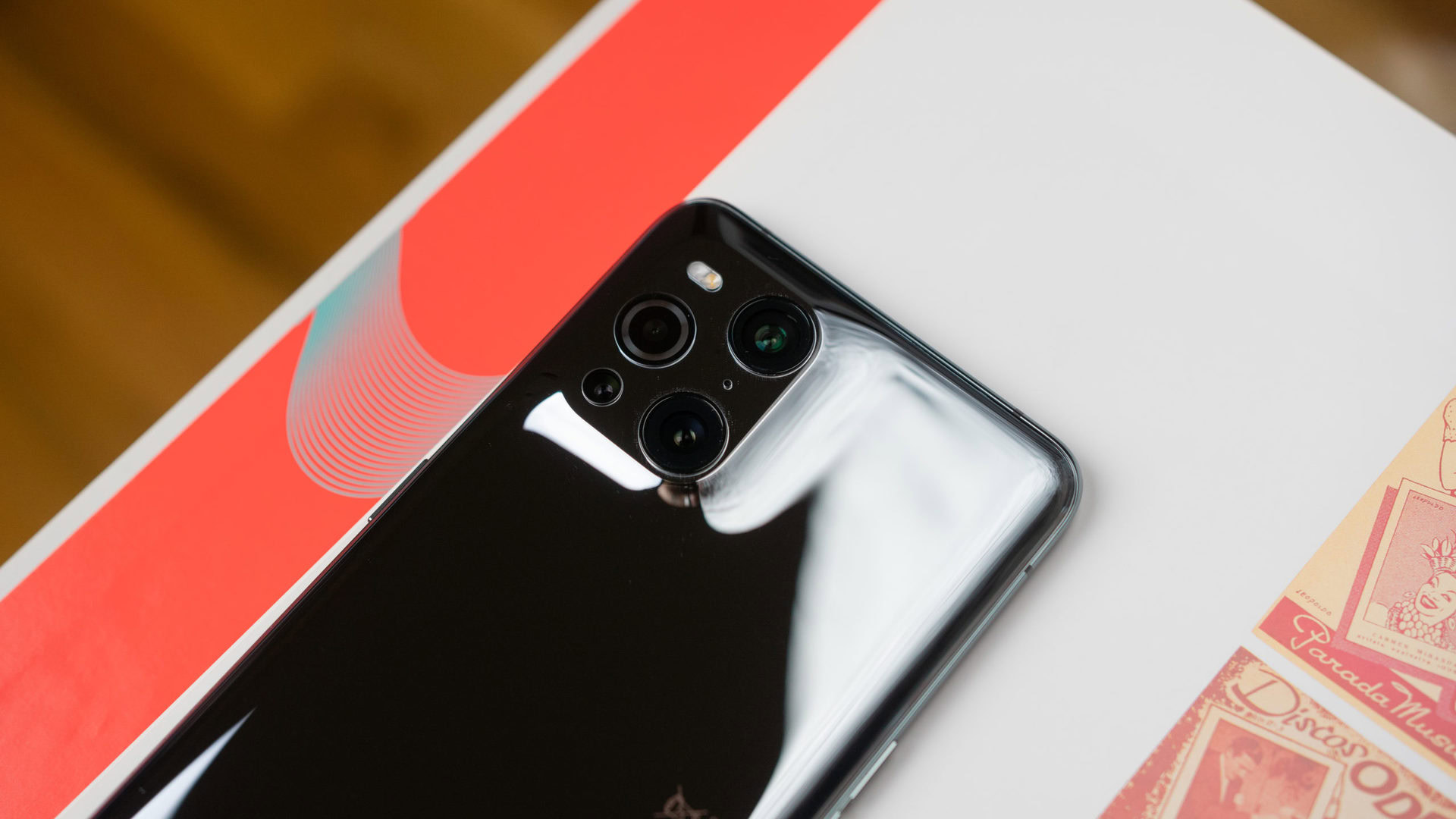 Oppo Find X3 Pro 5G camera bump with shiny reflections on the glossy back phone.