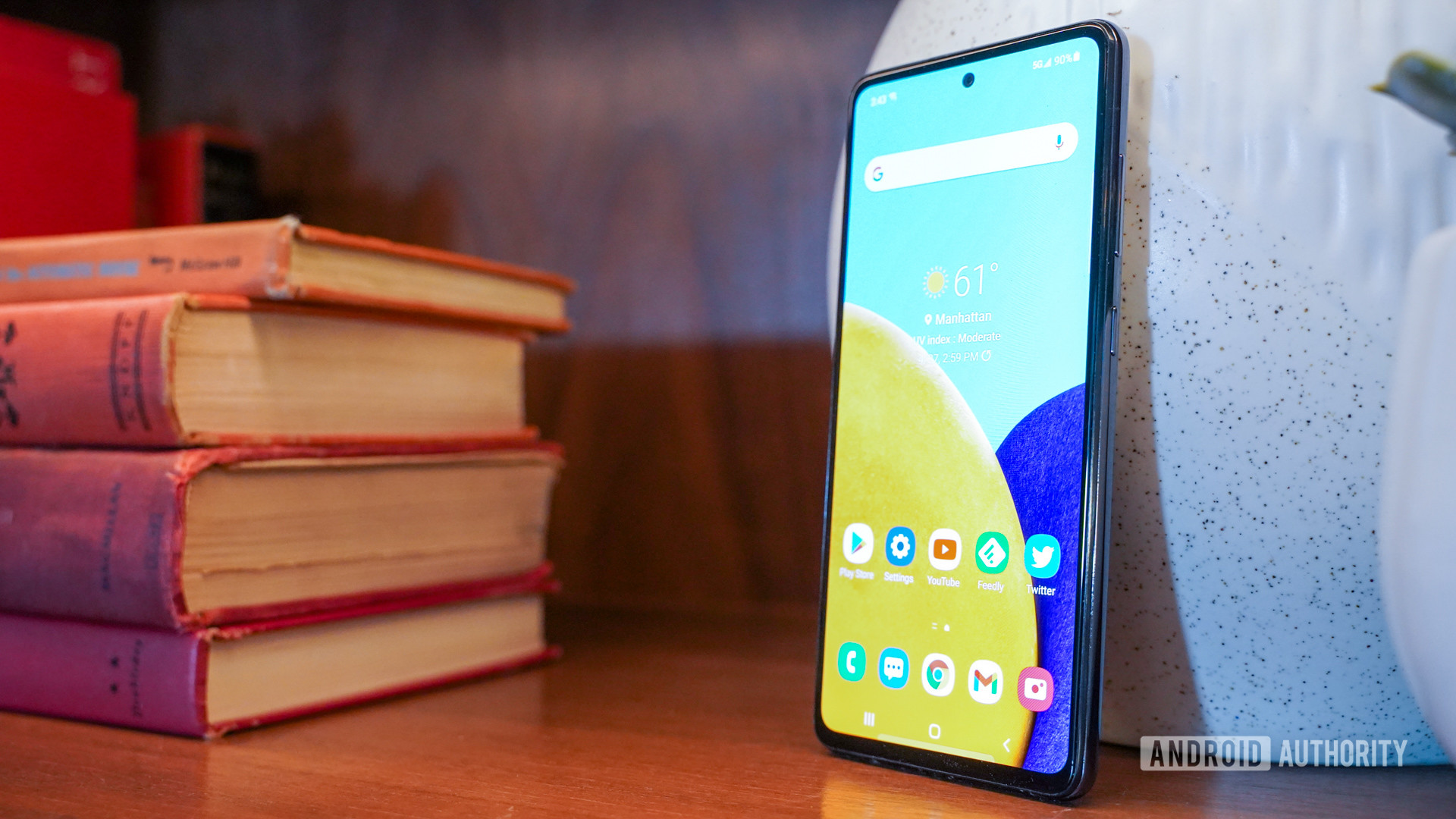 Samsung Galaxy A52 5G angled with books