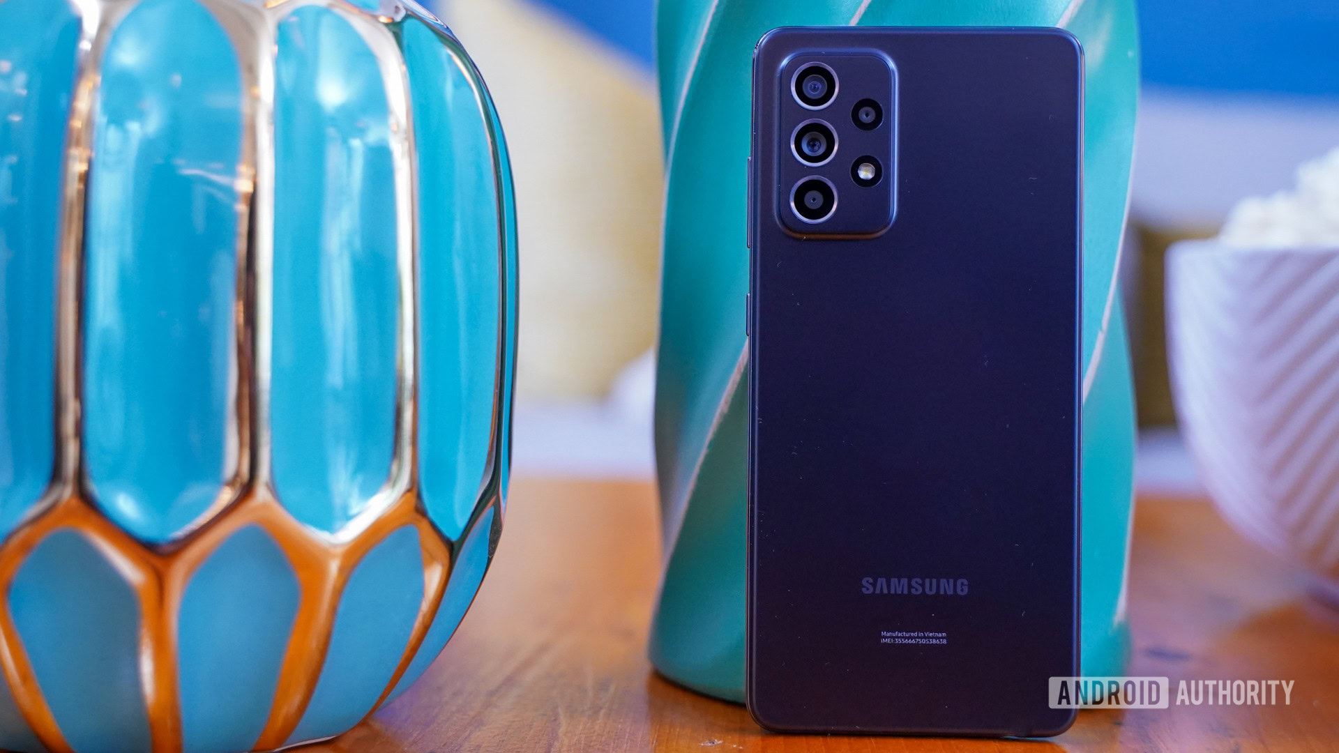 Samsung Galaxy A 52 5G standing with vases