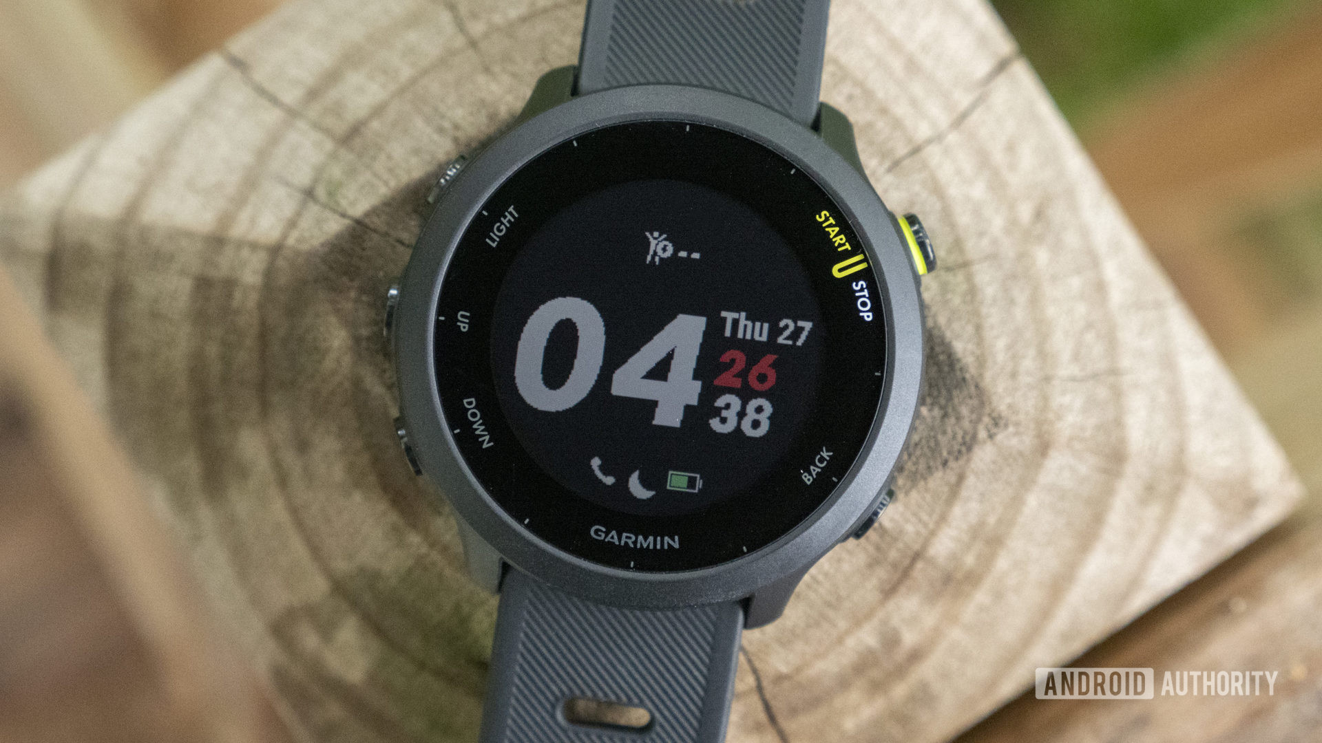 Garmin Forerunner 55 review watch face display on table 1