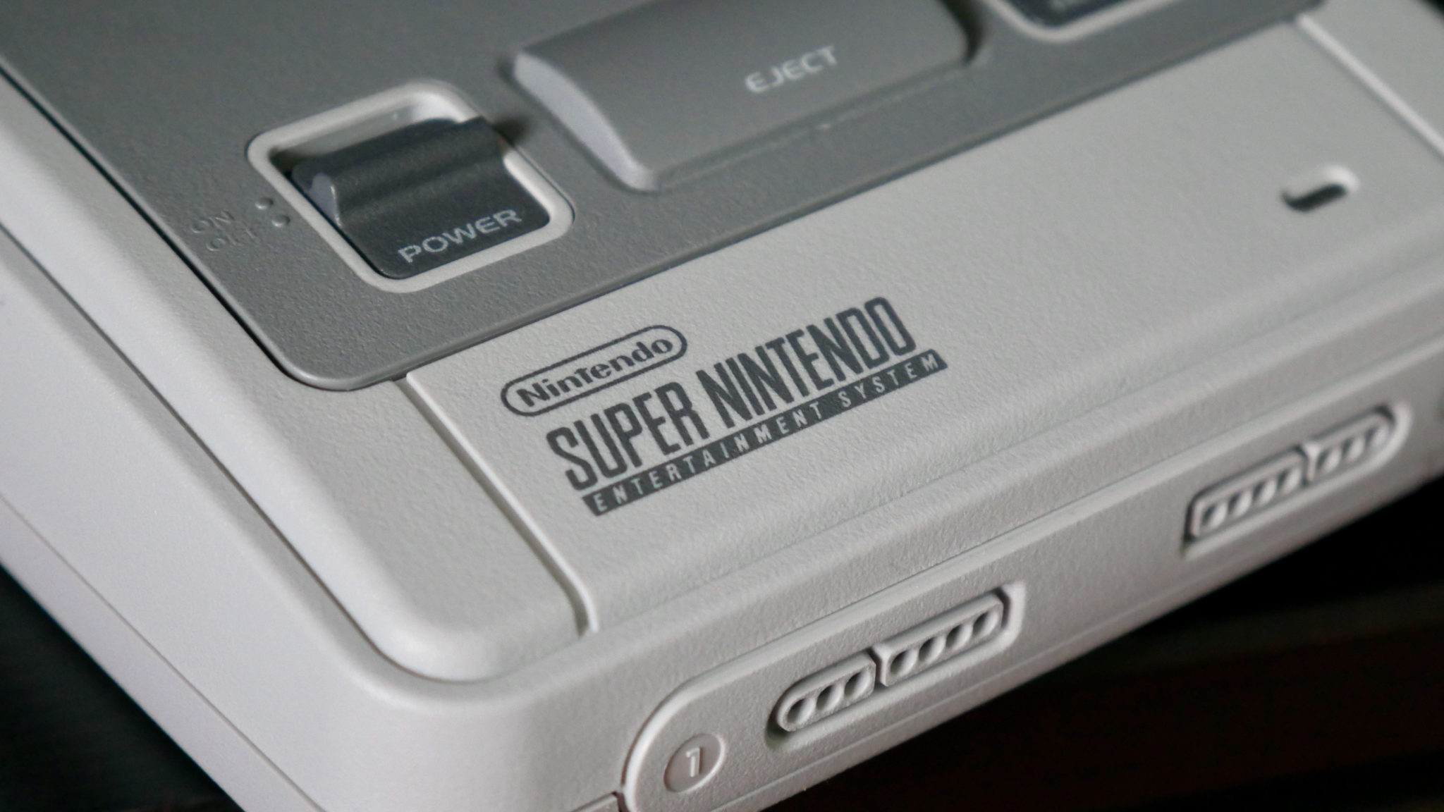 super nintendo snes console showing a closeup of the logo