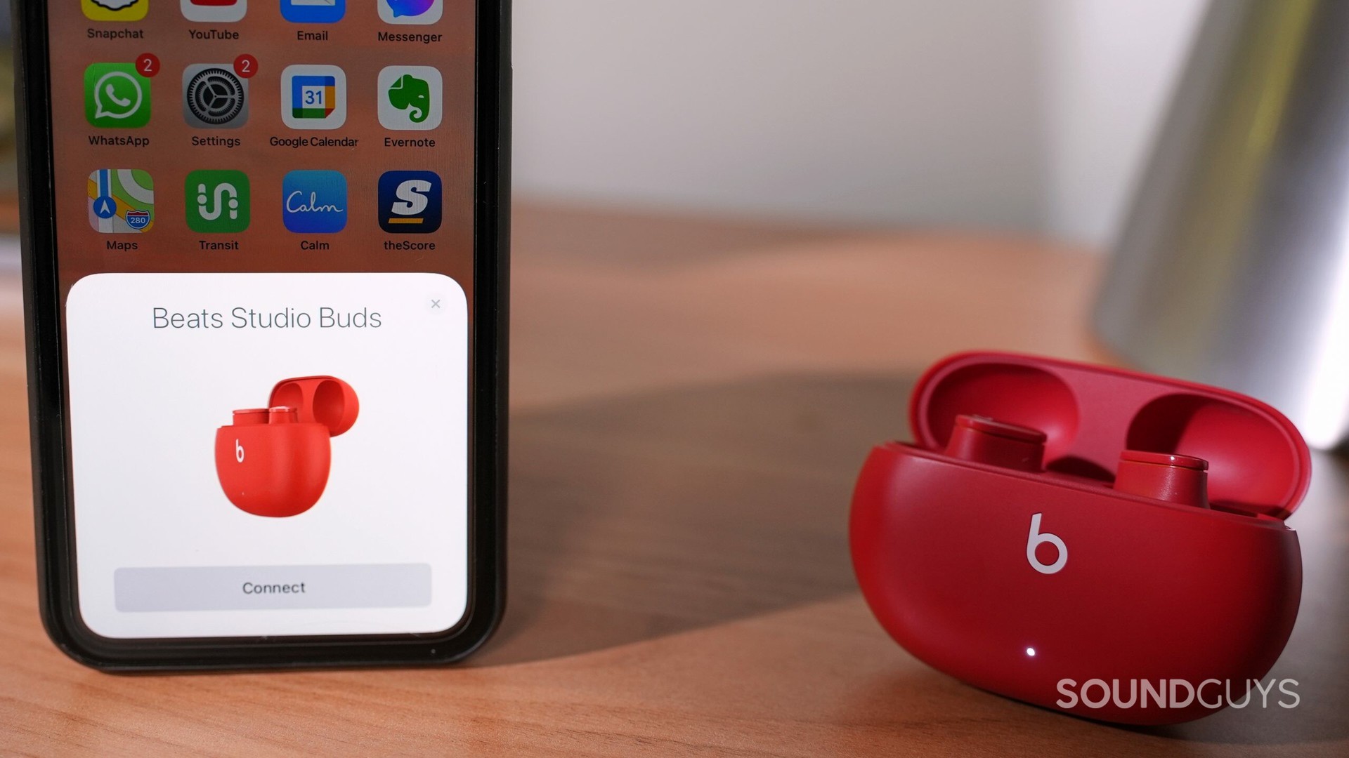 beats studio buds noise cancelling true wireless earphones in pairing mode with an iphone.