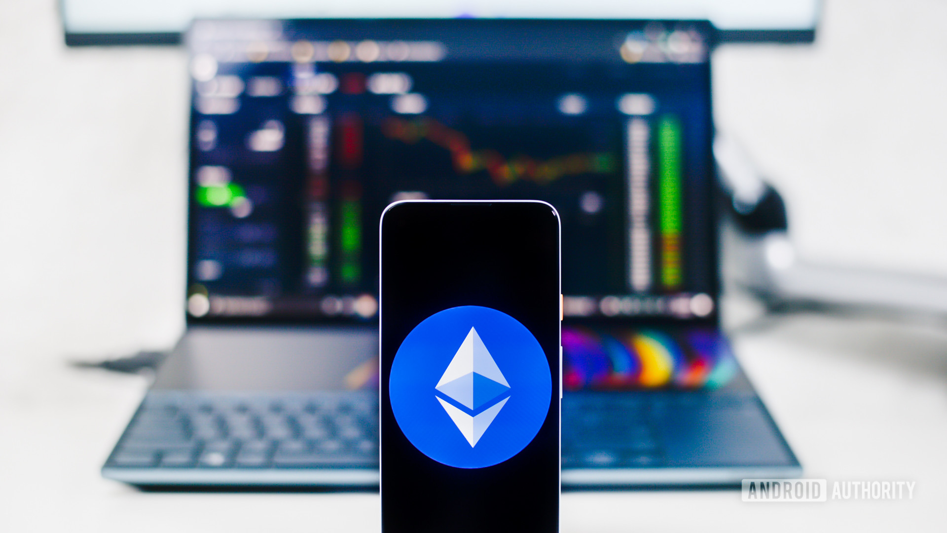 Ethereum on a smartphone and laptop.