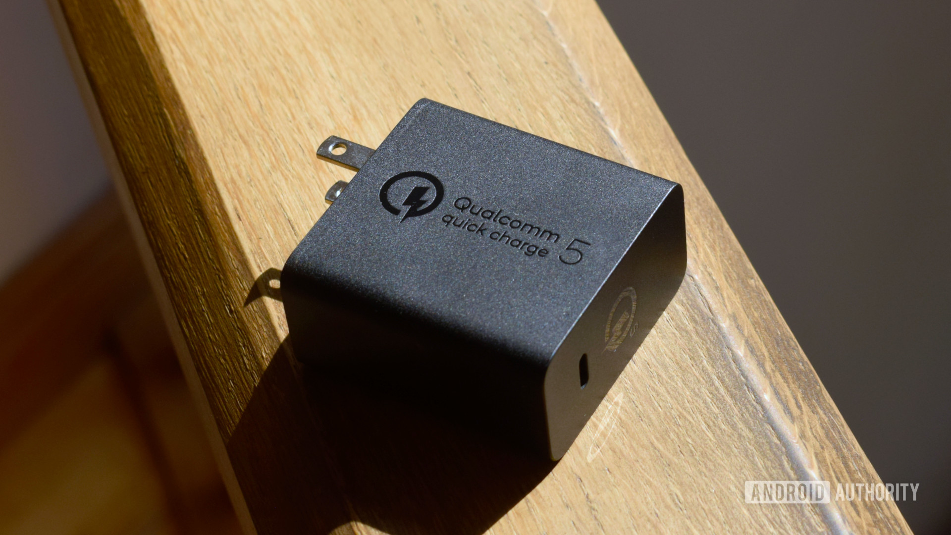 Qualcomm Quick Charge 5 charger lying on its side