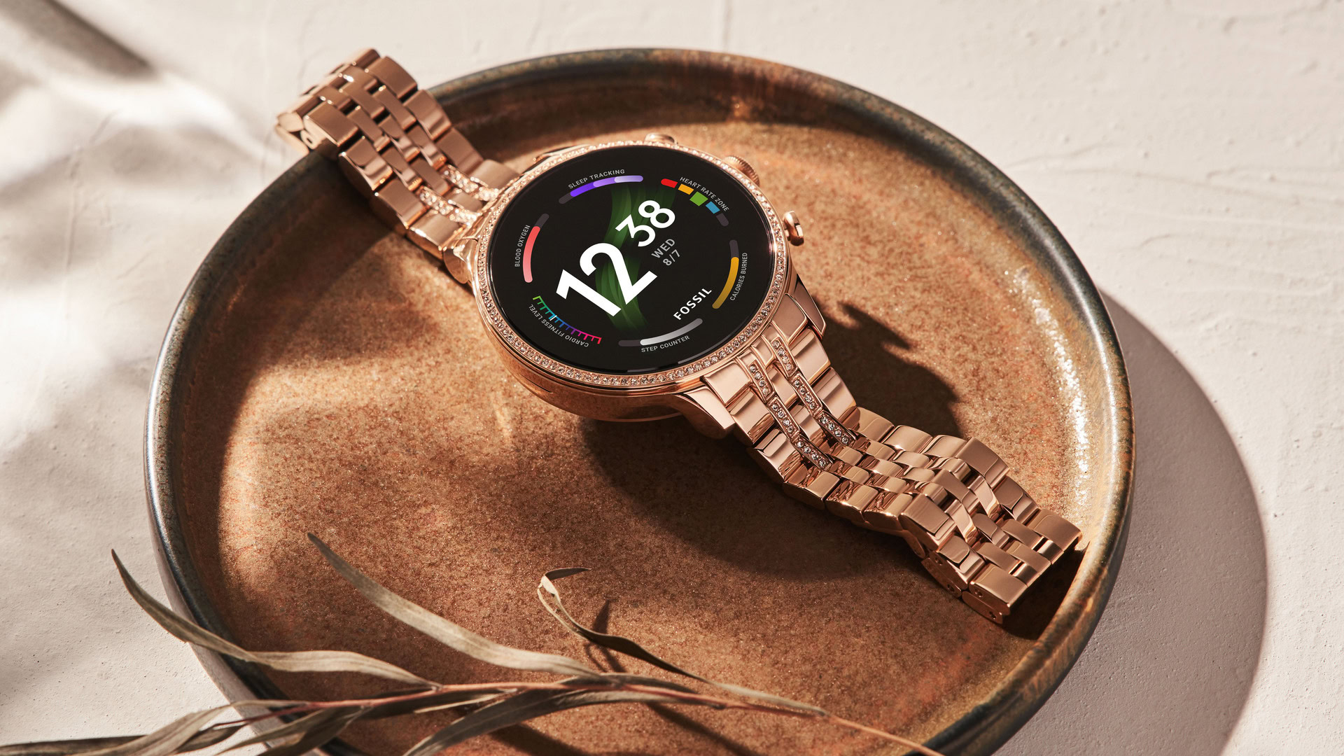 The Fossil Gen 6 Smartwatch in gold stainless steel in a bowl.