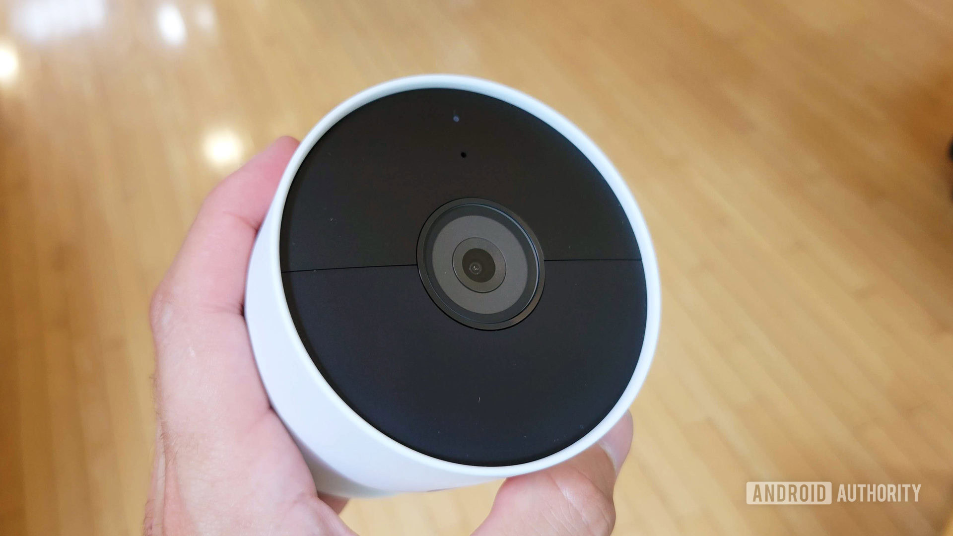 Google Nest Cam Review 2021 showing the front in hand