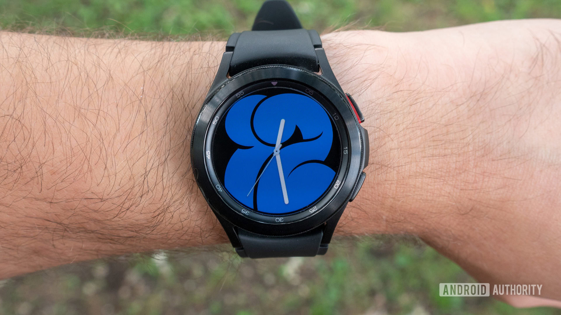 The Samsung Galaxy Watch 4 Classic on a wrist showing the watch face.