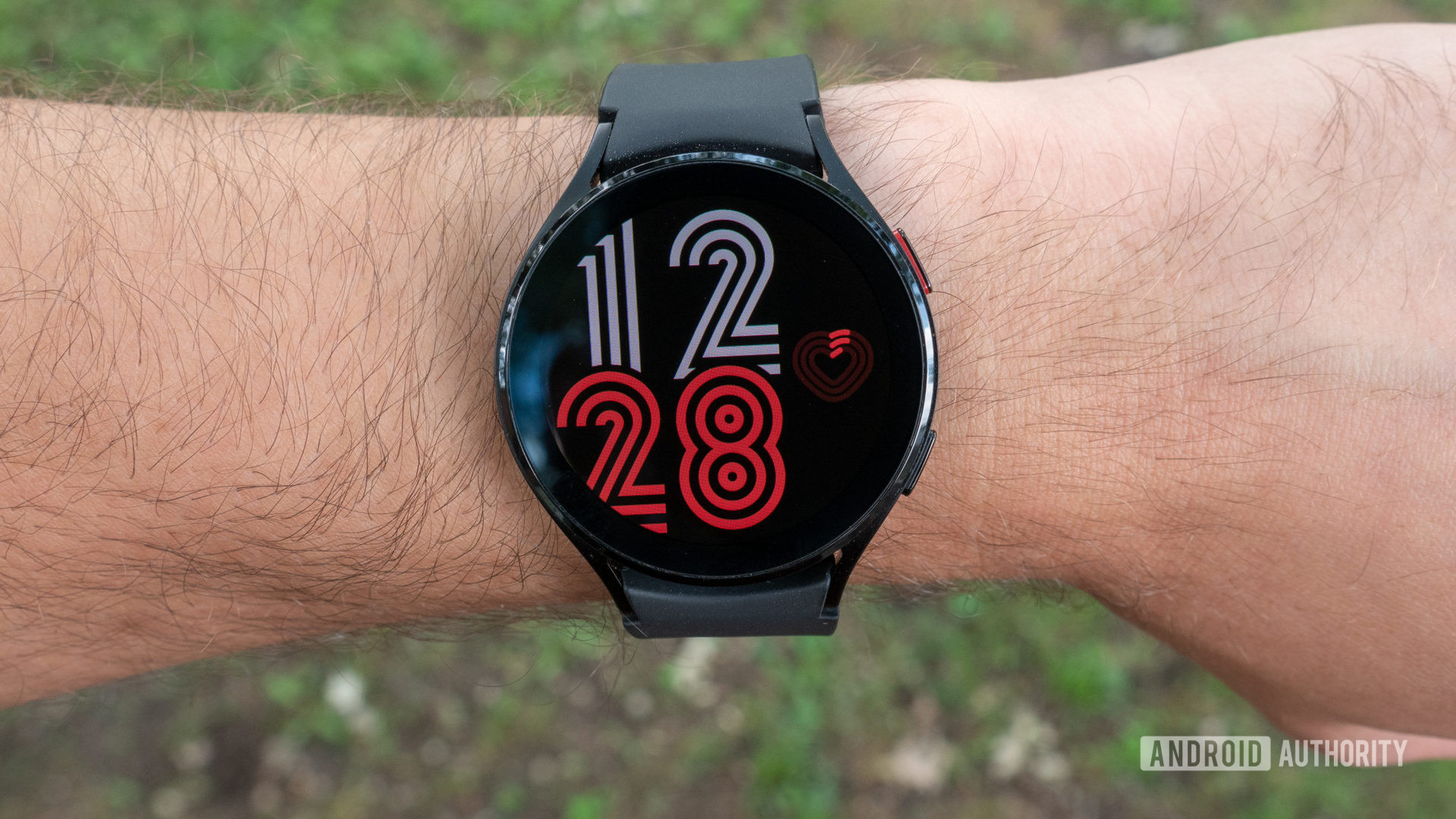The samsung galaxy watch 4 on a wrist showing the watch face